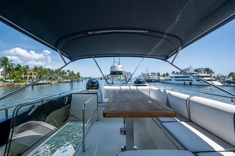 Blue B Yacht Photos Pics 2015 Beneteau Monte Carlo yacht with spacious deck and seating, cruising on a sunny day.