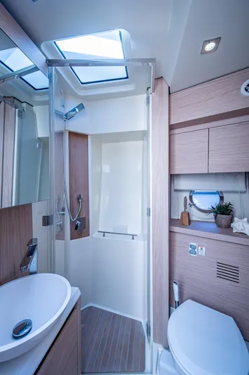 Blue B Yacht Photos Pics Luxurious bathroom in 2015 Beneteau Monte Carlo yacht with modern fixtures and skylight.