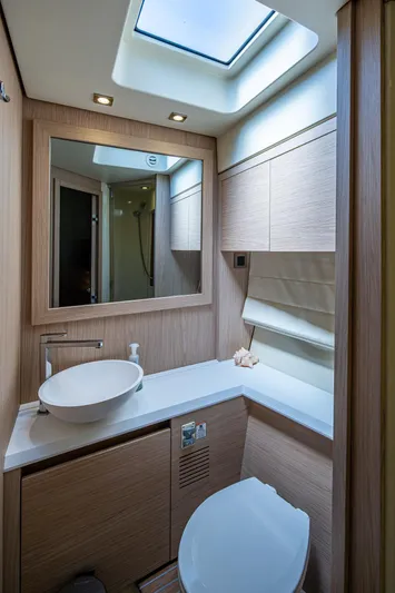 Blue B Yacht Photos Pics Luxurious bathroom in 2015 Beneteau Monte Carlo yacht with modern fixtures and skylight.