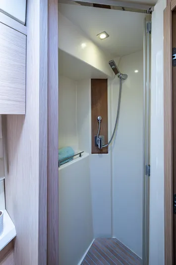 Blue B Yacht Photos Pics 2015 Beneteau MONTE CARLO yacht shower with modern fixtures and wooden accents.