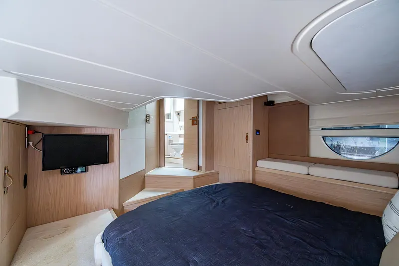 Blue B Yacht Photos Pics Luxurious interior of 2015 Beneteau Monte Carlo yacht with cozy bed and modern amenities.
