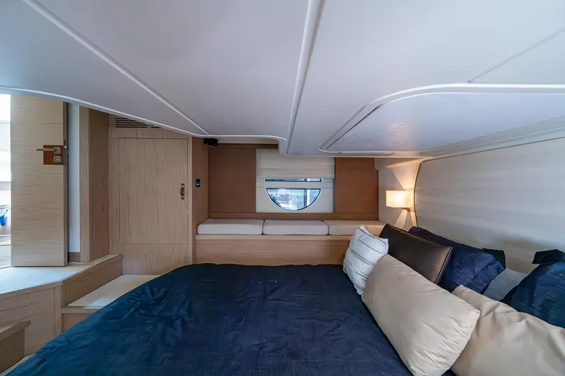 Blue B Yacht Photos Pics Luxurious cabin interior of 2015 Beneteau Monte Carlo yacht with cozy bedding.