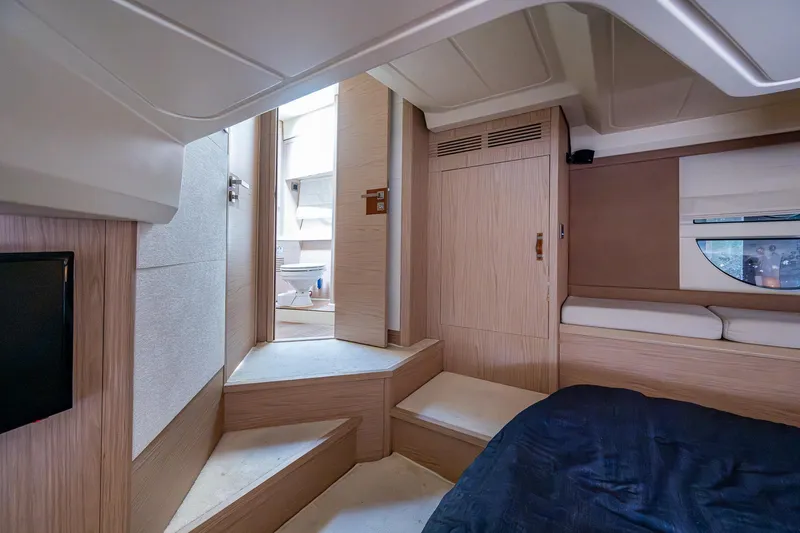 Blue B Yacht Photos Pics Luxurious interior of 2015 Beneteau Monte Carlo yacht with modern wood finish.