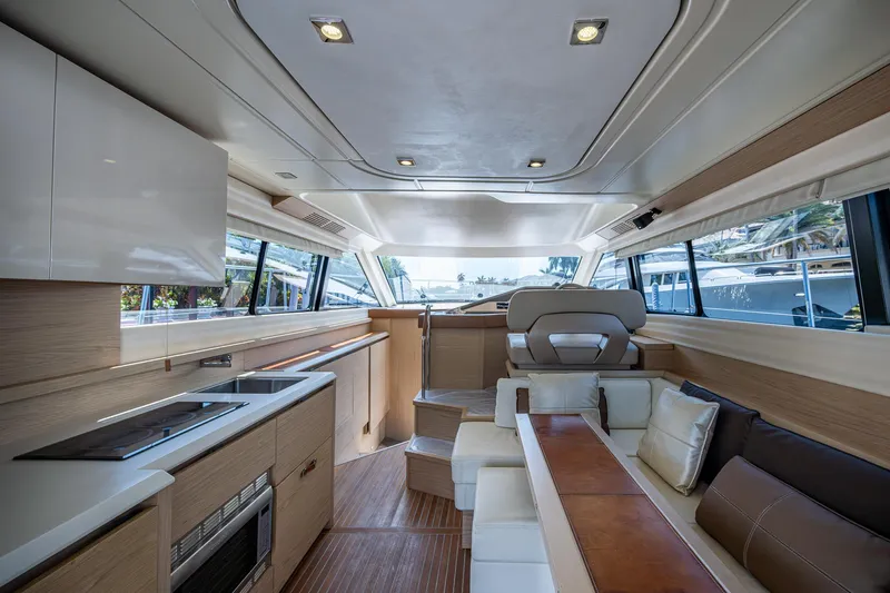 Blue B Yacht Photos Pics Luxurious interior of 2015 Beneteau Monte Carlo yacht with modern kitchen and seating area.