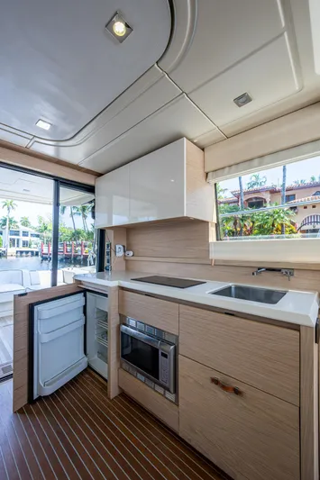 Blue B Yacht Photos Pics 2015 Beneteau MONTE CARLO yacht kitchen with modern appliances and sleek design.