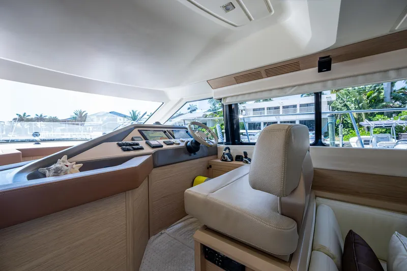 Blue B Yacht Photos Pics 2015 Beneteau Monte Carlo yacht interior with modern helm and panoramic windows.
