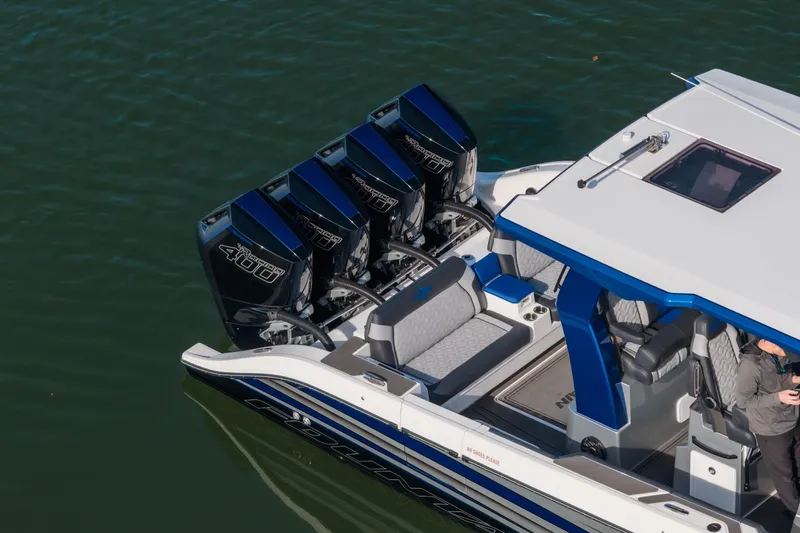  Yacht Photos Pics 2025 Fountain 43 SCX boat with four powerful outboard engines on water.