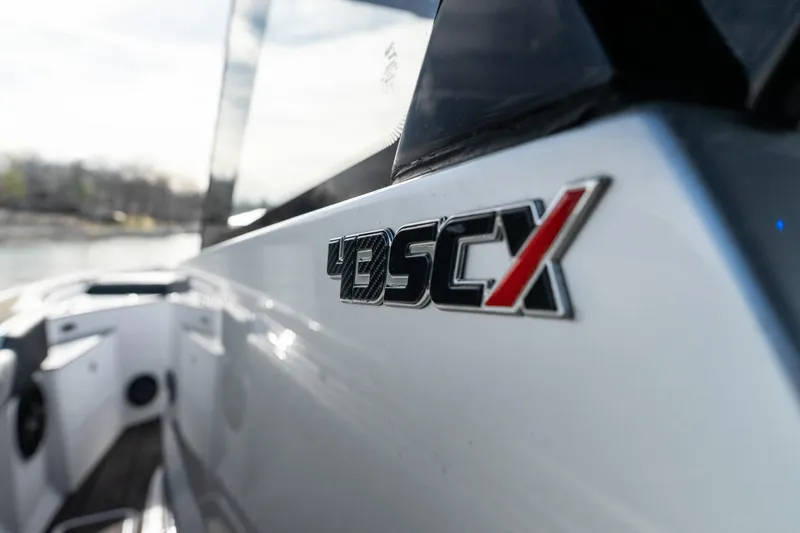  Yacht Photos Pics Close-up of 2025 Fountain 43 SCX boat logo on sleek exterior.