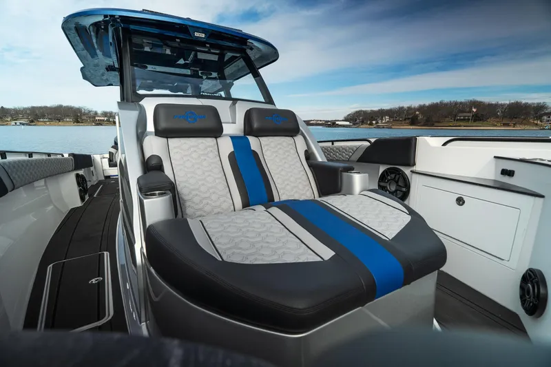  Yacht Photos Pics 2025 Fountain 43 SCX boat interior with luxurious seating and modern design on a serene lake.