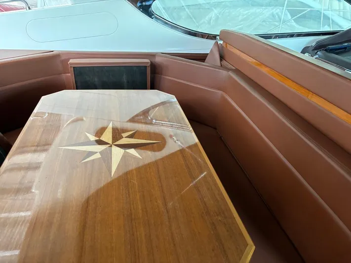  Yacht Photos Pics Luxurious interior of 1998 Cantieri di Sarnico MAXIM 55 SPECIAL yacht with wooden table.