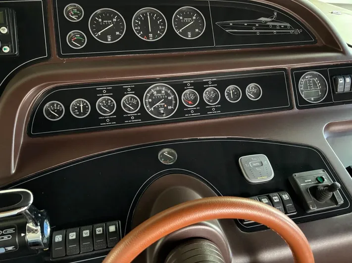  Yacht Photos Pics Control panel of a 1998 Cantieri di Sarnico MAXIM 55 SPECIAL yacht with gauges and switches.