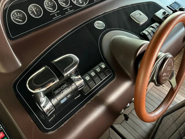  Yacht Photos Pics Control panel of 1998 Cantieri di Sarnico MAXIM 55 SPECIAL yacht with gauges and steering wheel.