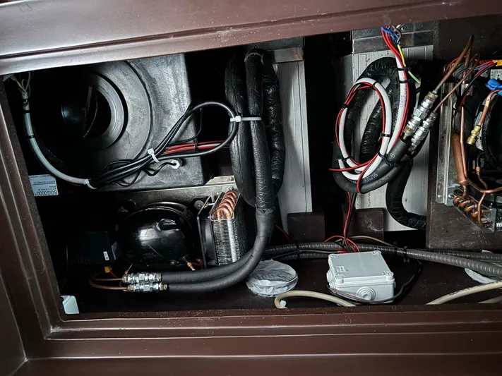  Yacht Photos Pics Engine compartment of 1998 Cantieri di Sarnico MAXIM 55 SPECIAL with visible wiring and components.