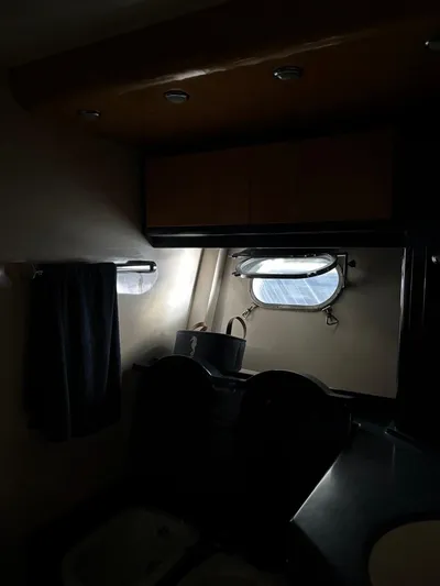  Yacht Photos Pics Dimly lit interior of a 1998 Cantieri di Sarnico MAXIM 55 SPECIAL yacht cabin.