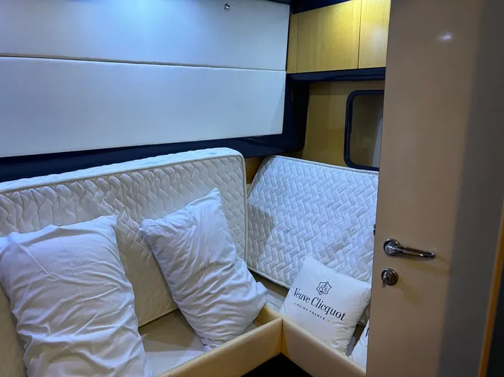  Yacht Photos Pics Cozy cabin interior of 1998 Cantieri di Sarnico MAXIM 55 SPECIAL yacht with pillows and bedding.