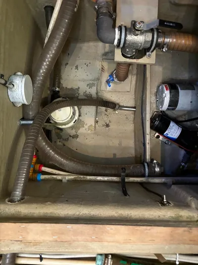  Yacht Photos Pics Engine compartment of 1998 Cantieri di Sarnico MAXIM 55 SPECIAL with hoses and mechanical components.