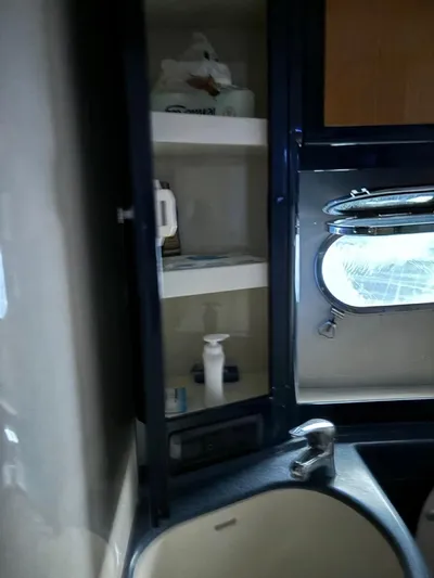  Yacht Photos Pics Cabinet and sink area inside 1998 Cantieri di Sarnico MAXIM 55 SPECIAL yacht bathroom.