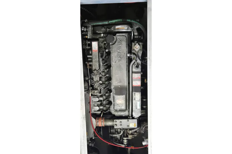 Polly Yacht Photos Pics Engine of 2000 Mainship 390 Trawler, detailed view of mechanical components.