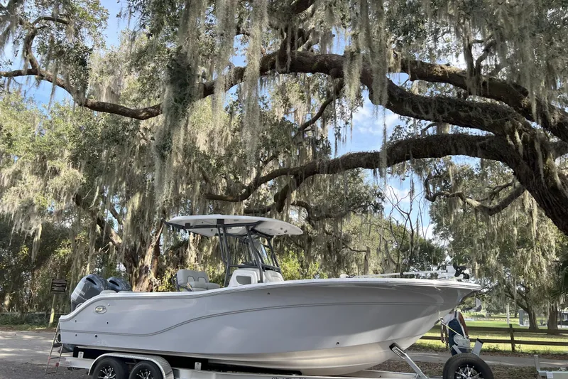 Your Next Boat! Yacht Photos Pics 2023 Sea Fox 268 Commander boat on trailer under mossy trees.