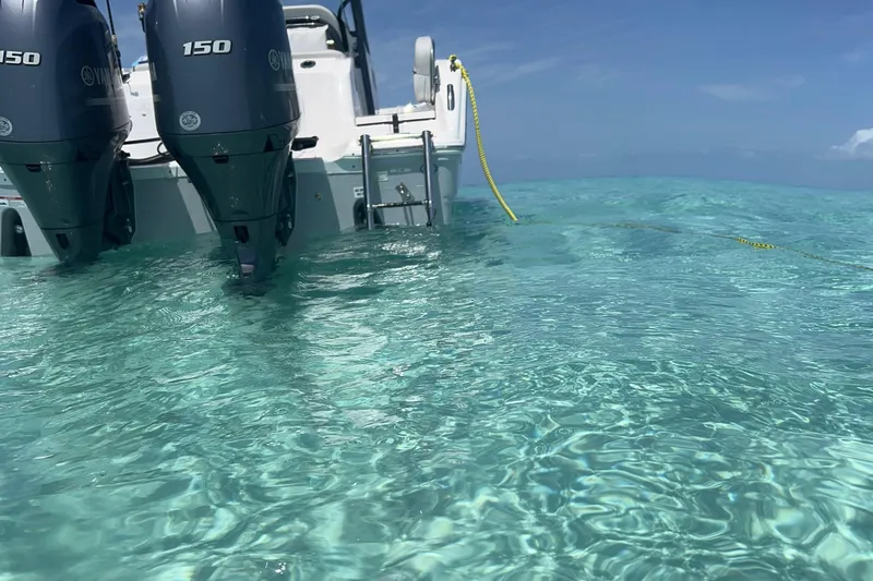 Your Next Boat! Yacht Photos Pics Sea Fox 268 Commander 2023 in clear turquoise water, featuring dual Yamaha 150 engines.