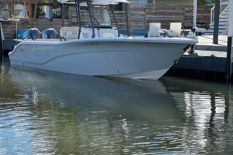 Your Next Boat! Yacht Photos Pics 2023 Sea Fox 268 Commander boat docked in calm waters.