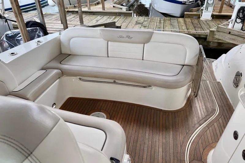 Finding Time Yacht Photos Pics Luxurious 2011 Sea Ray 350 Sundancer boat interior with elegant seating and wooden flooring.
