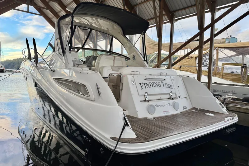 Finding Time Yacht Photos Pics 2011 Sea Ray 350 Sundancer docked, rear view, with "Finding Time" nameplate, Vancouver, BC.