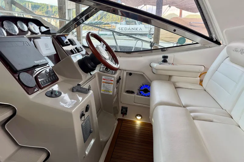 Finding Time Yacht Photos Pics 2011 Sea Ray 350 Sundancer helm with leather seating and modern navigation controls.