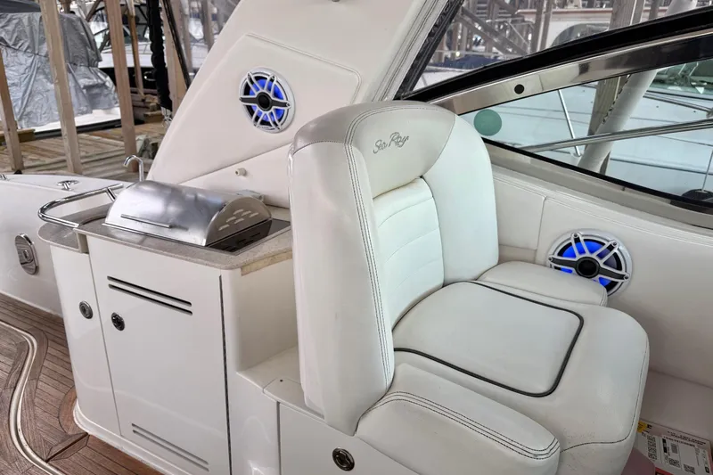 Finding Time Yacht Photos Pics 2011 Sea Ray 350 Sundancer interior with white seating and built-in grill.