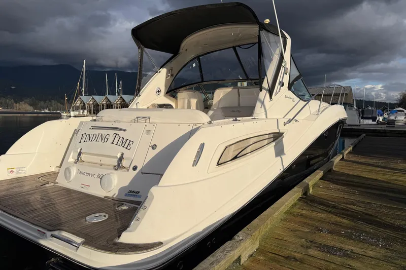 Finding Time Yacht Photos Pics 2011 Sea Ray 350 Sundancer docked, overcast sky, Vancouver marina backdrop.