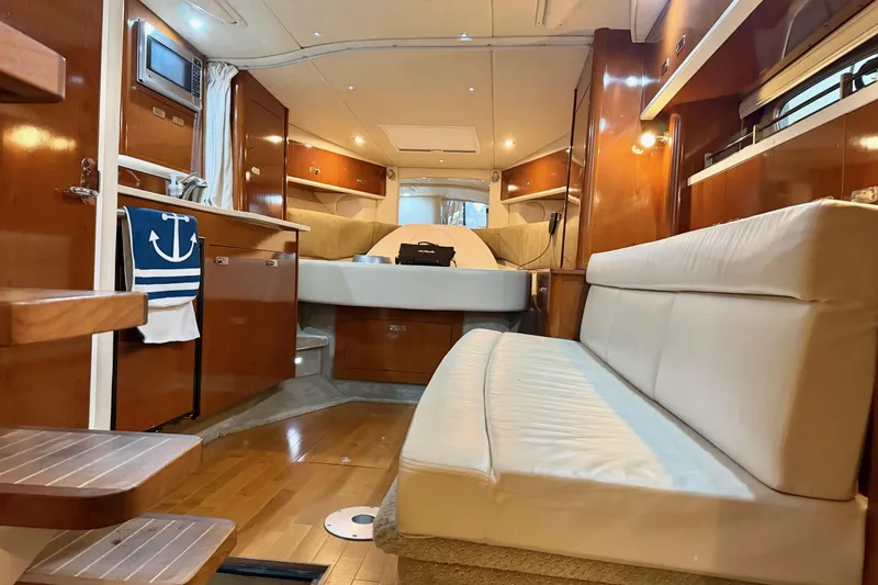 Finding Time Yacht Photos Pics Interior of 2011 Sea Ray 350 Sundancer yacht with modern furnishings and wood finishes.