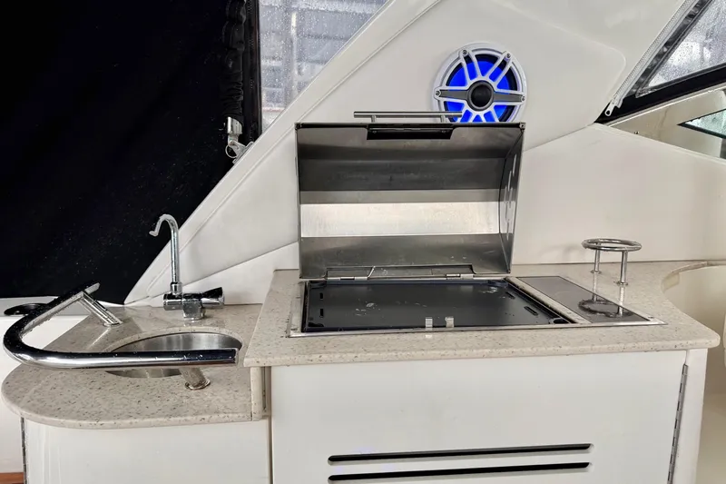 Finding Time Yacht Photos Pics Outdoor kitchen on 2011 Sea Ray 350 Sundancer yacht with sink and grill.