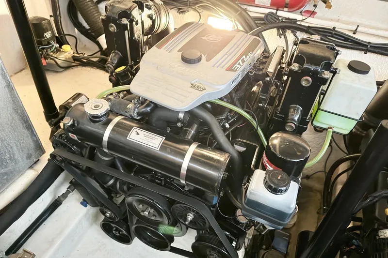 Finding Time Yacht Photos Pics Engine compartment of a 2011 Sea Ray 350 Sundancer boat, showcasing detailed components.