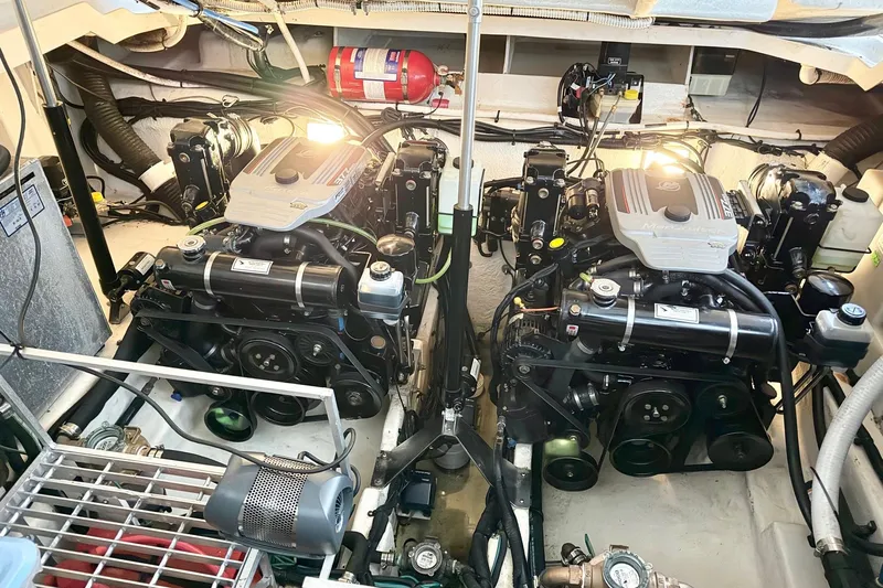 Finding Time Yacht Photos Pics Engine room of 2011 Sea Ray 350 Sundancer with twin engines and fire extinguisher.