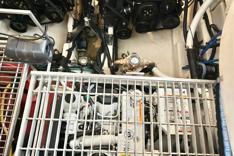 Finding Time Yacht Photos Pics Engine compartment of a 2011 Sea Ray 350 Sundancer with visible components and wiring.