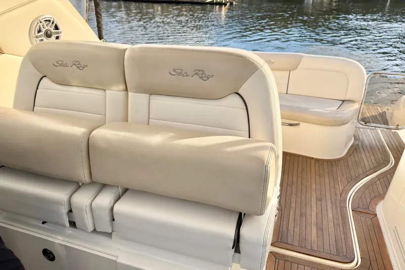 Finding Time Yacht Photos Pics 2011 Sea Ray 350 Sundancer boat interior with beige seating and wooden deck.