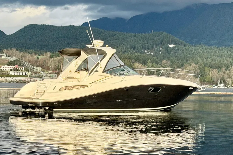 Finding Time Yacht Photos Pics 2011 Sea Ray 350 Sundancer yacht on calm water with scenic mountain backdrop.