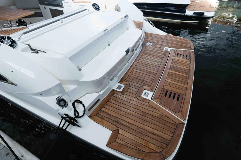  Yacht Photos Pics 2021 Sea Ray SLX 350 boat with elegant wooden deck and sleek design.