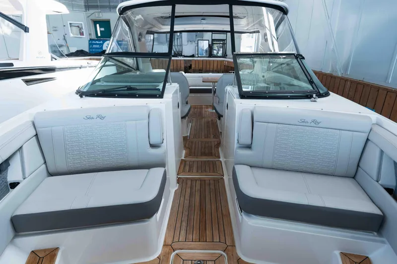  Yacht Photos Pics 2021 Sea Ray SLX 350 boat interior with luxurious seating and wooden flooring.