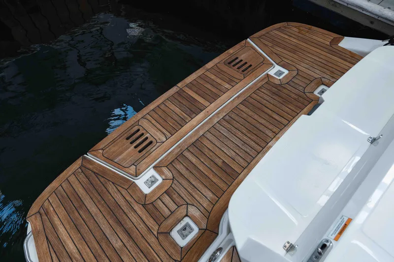  Yacht Photos Pics Teak swim platform on 2021 Sea Ray SLX 350 boat, docked by water.