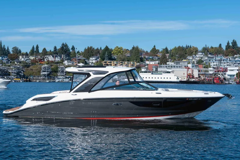  Yacht Photos Pics 2021 Sea Ray SLX 350 boat cruising on a scenic lake with waterfront homes.