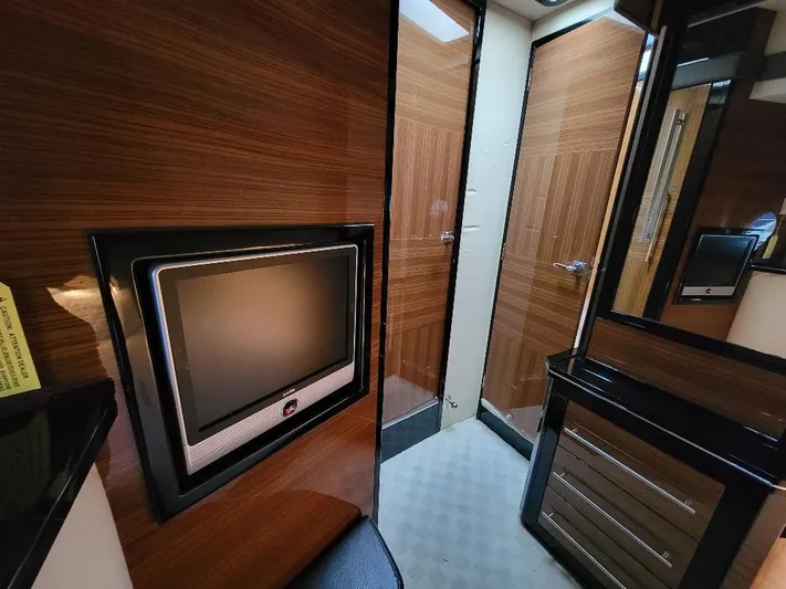  Yacht Photos Pics 2009 Marquis SC interior with wood paneling and built-in TV.