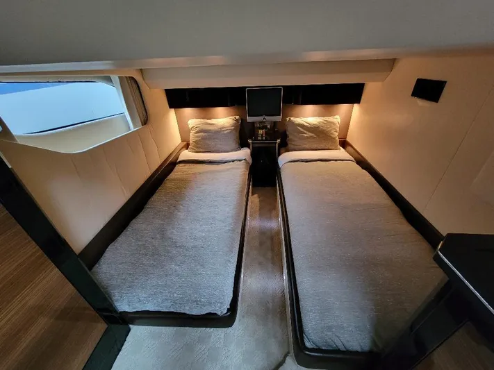  Yacht Photos Pics Luxurious twin cabin in 2009 Marquis SC yacht, featuring modern design and ambient lighting.