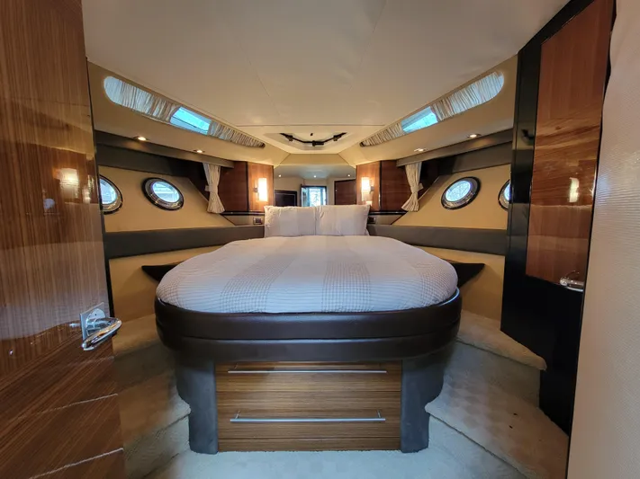  Yacht Photos Pics Luxurious 2009 Marquis SC yacht bedroom with circular bed and elegant wood finishes.