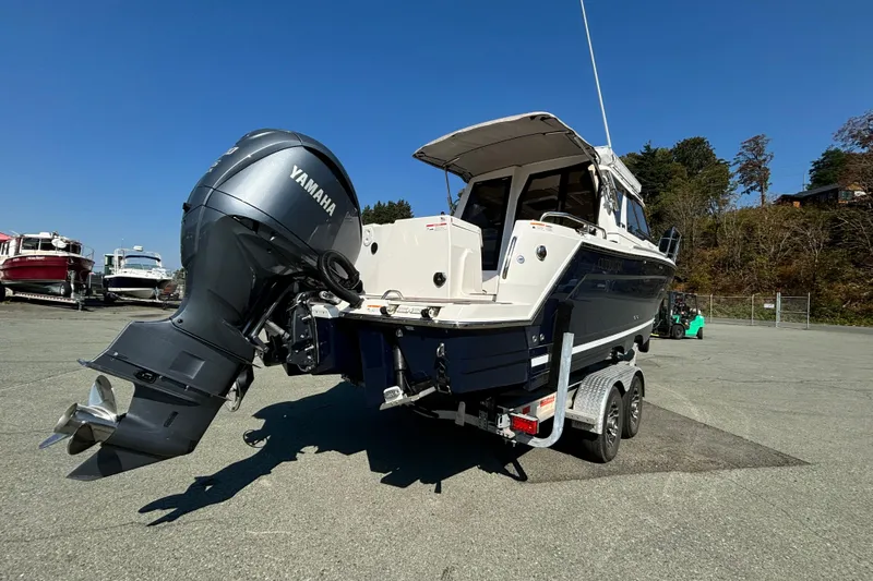  Yacht Photos Pics 2024 Cutwater C-248 Coupe boat with Yamaha outboard motor on a trailer.
