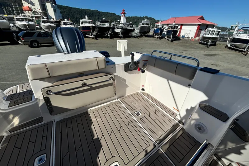  Yacht Photos Pics 2024 Cutwater C-248 Coupe boat interior with sleek deck and seating at a marina.