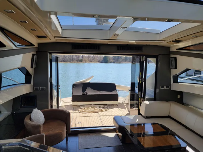  Yacht Photos Pics Luxurious 2009 Marquis SC yacht interior with lake view through open doors.
