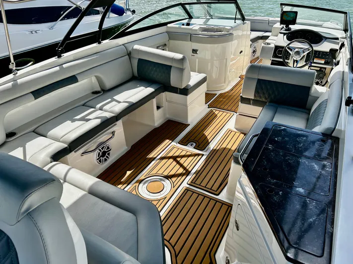 2016 Sea Ray 290 Sundeck @ Cancun Yacht Photos Pics 2016 Sea Ray 290 Sundeck interior with luxurious seating and teak flooring.