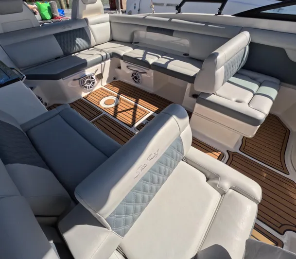 2016 Sea Ray 290 Sundeck @ Cancun Yacht Photos Pics Luxurious seating area on a 2016 Sea Ray 290 Sundeck boat with wood flooring.