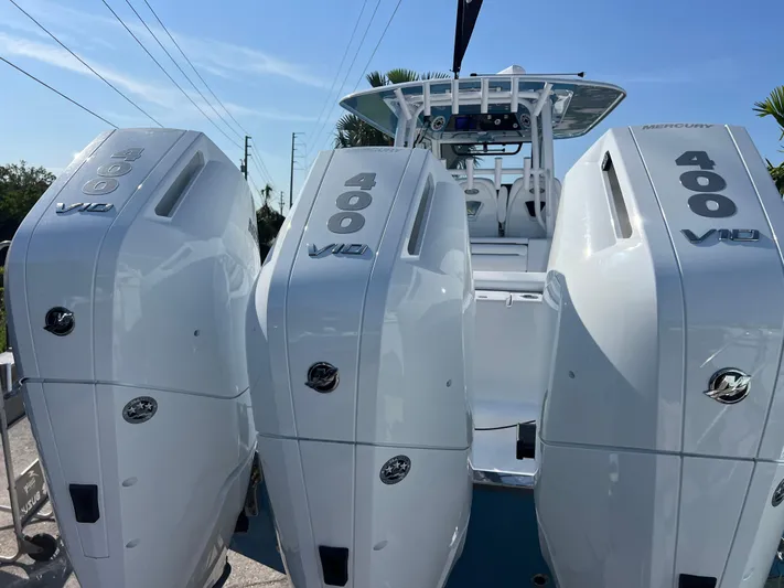  Yacht Photos Pics 2025 Sportsman 352 Open with triple 400 V12 engines, showcasing powerful marine performance.